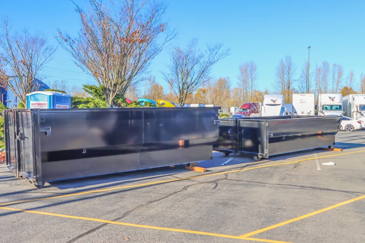 Professional dumpster rental service with roll-off container on residential driveway in Briarcliff Manor